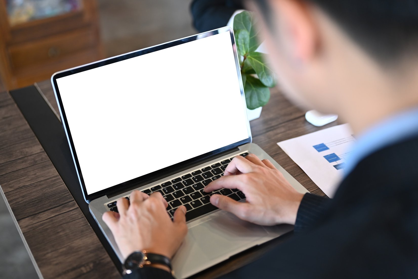 A Businessman Working Online with a Computer Laptop. Blank Scree